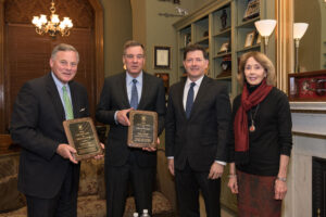 Presenting a certificate to Senator Burr and Warner