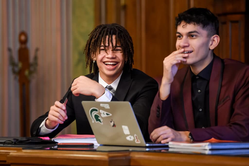 Image of two students in the courtroom